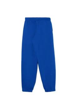 Sale Cropp e dresowe joggery z naszywką niebieski